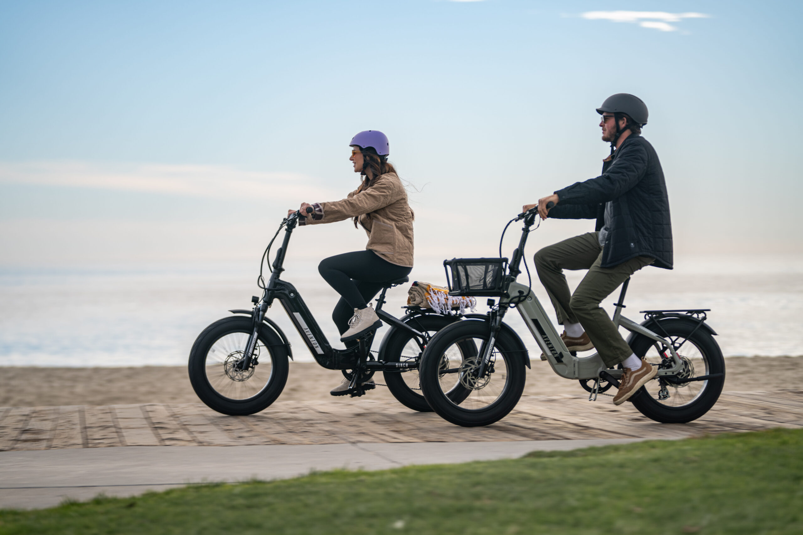 a man and woman riding e-bikes