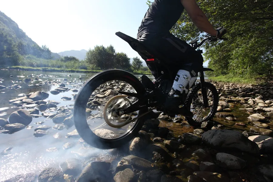 E-bike riding through creek