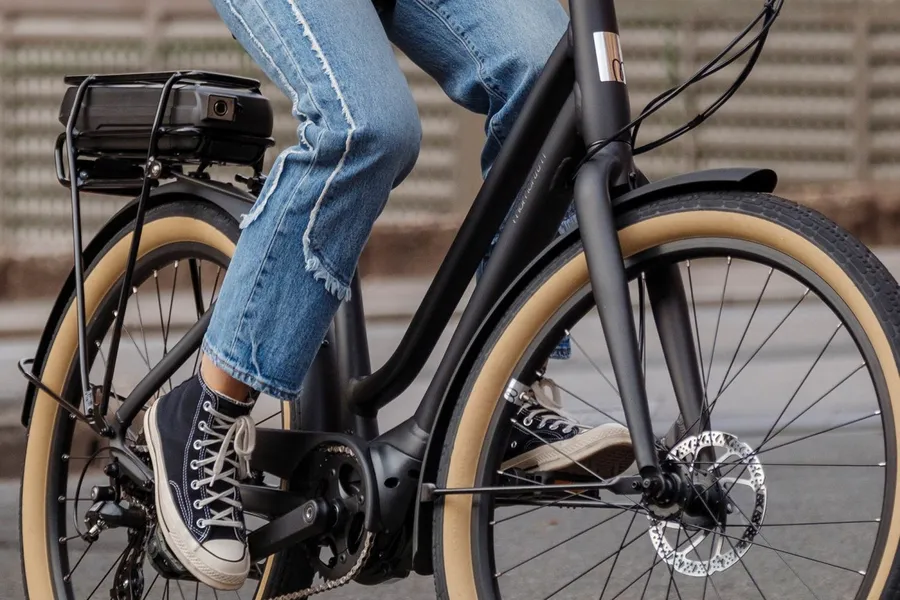 a person's legs on a e-bike