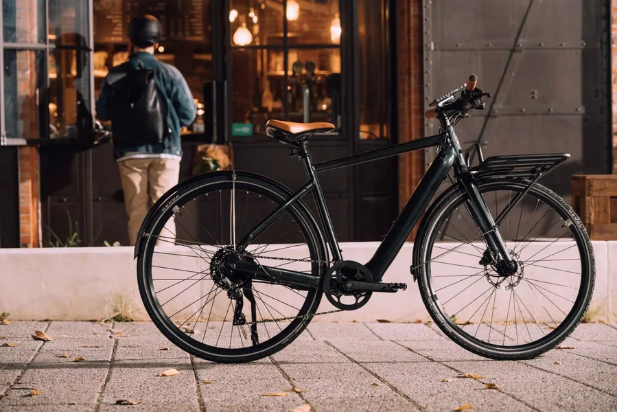 a bicycle parked on a sidewalk