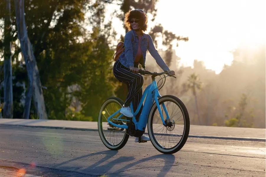 a woman riding a e-bike