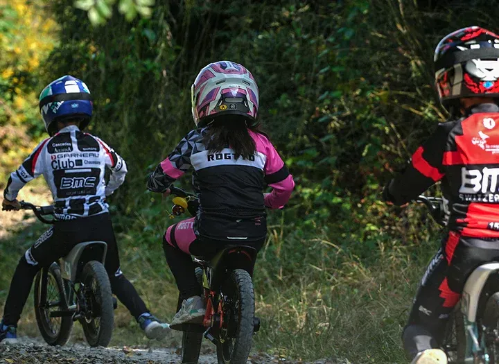 a group of kids riding e-bike