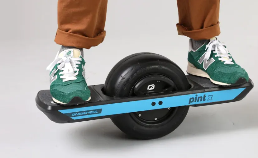 Riding OneWheel in green shoes