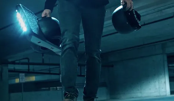 Guy carrying OneWheel