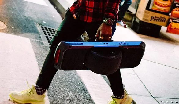 Guy carrying OneWheel