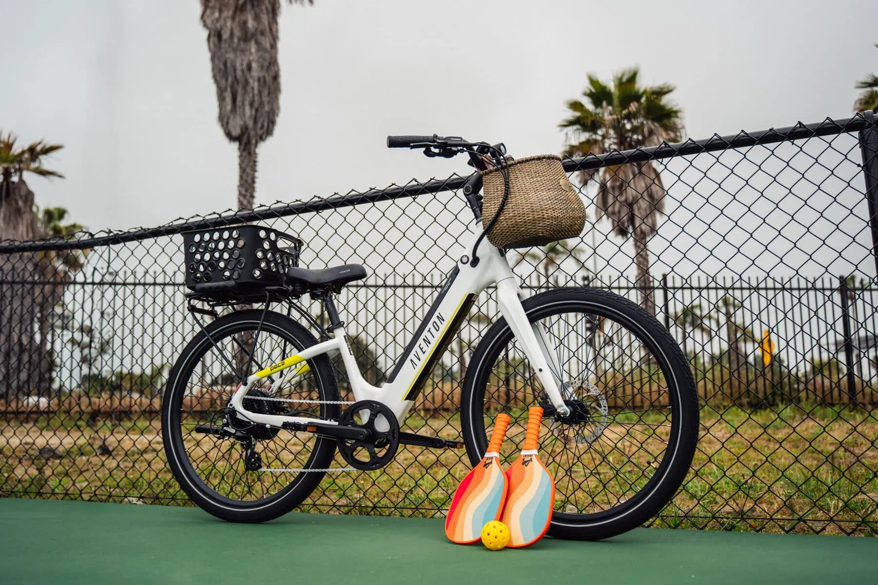 a e-bike parked next to a fence