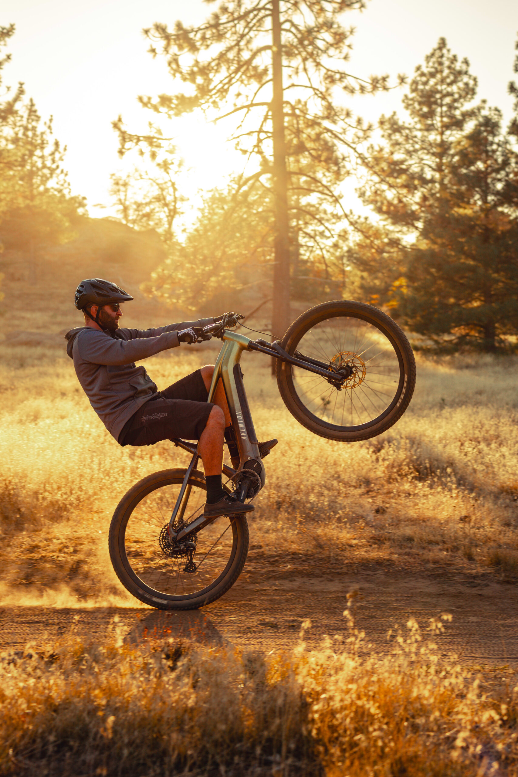 a man on a e-bike with a wheelie