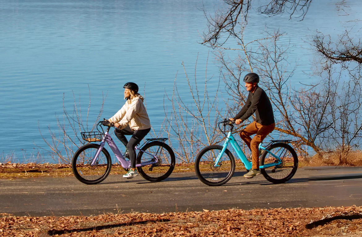 couple riding breezes by lake