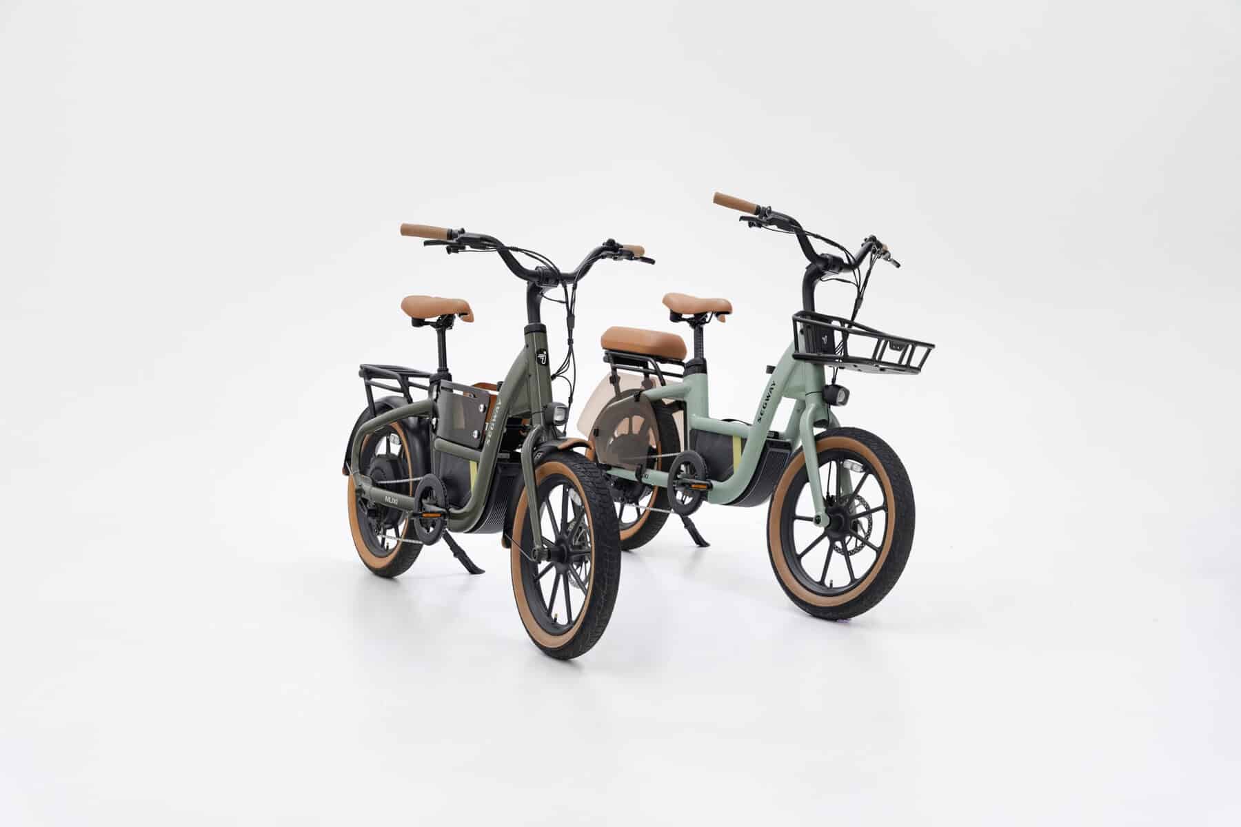 Two Segway MUXI e-bikes in Olive Rush and Dusty Sage with basket, distant right front angle