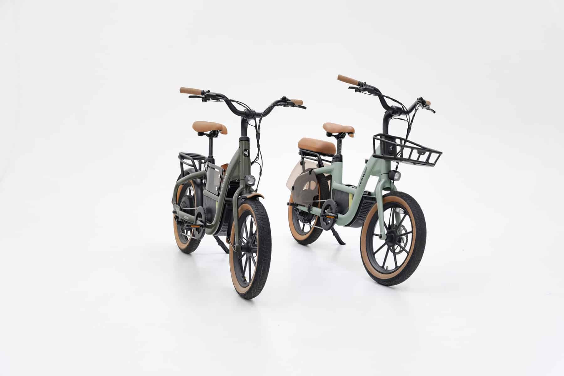 Two Segway MUXI e-bikes in Olive Rush and Dusty Sage colors, right front angle